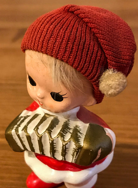 Figurine of Child Playing Concertina - TheReedLounge.com