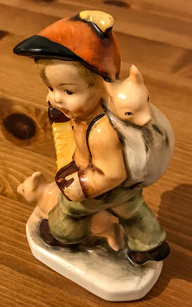 Porcelain figurine of a boy playing concertina - TheReedLounge.com
